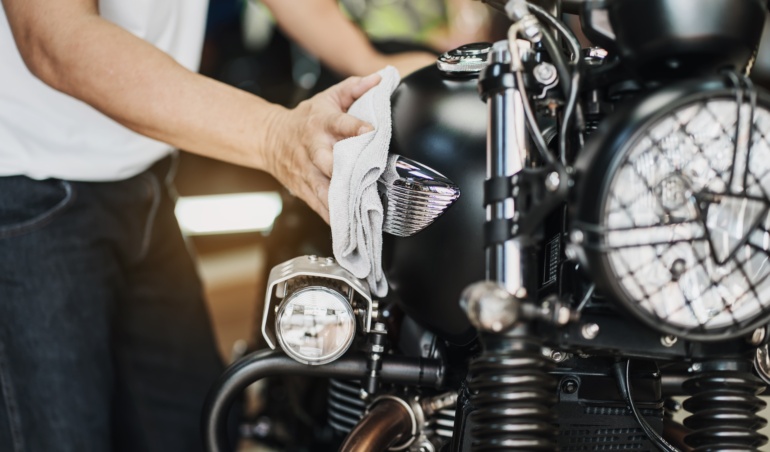 biker,man,cleaning,motorcycle,,,polished,and,coating,wax,on